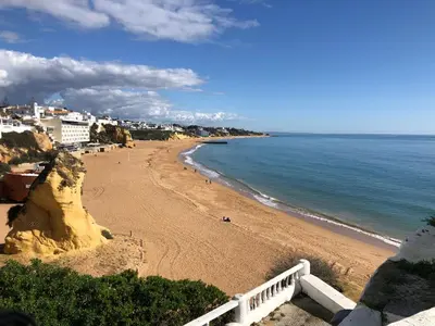 a view of a beach with the ocean and buildings at Albufeira studio Bellevista in Albufeira