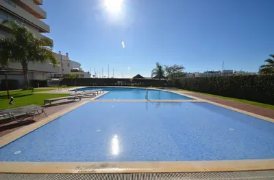 a balcony with a view of a building at Marina Vilamoura - Aquamar 402 By Vilamoura Sun in Quarteira