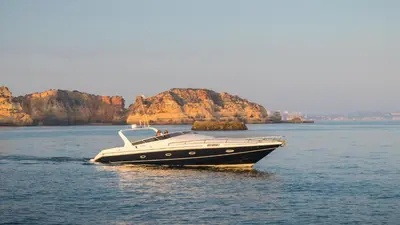 a black and white boat in the water at Marina Vilamoura - Aquamar 402 By Vilamoura Sun in Quarteira