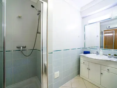 a bathroom with a shower and a sink at Apartment Penthouse Milea by Interhome in Patroves