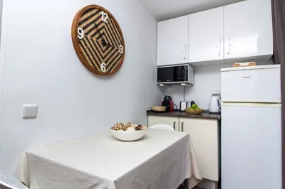 a kitchen with a table with a bowl on it at Açoteias 203 in Albufeira
