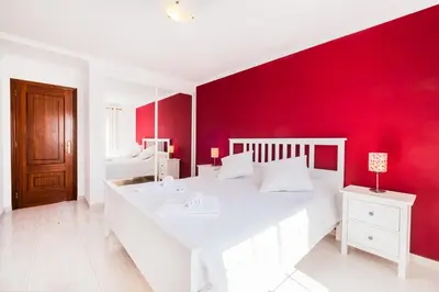 a kitchen with a counter top with a microwave at Apartment Marlena - complex great for families in Albufeira