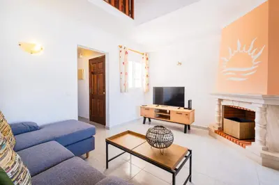 a red bedroom with a white bed and a red wall at Apartment Marlena - complex great for families in Albufeira