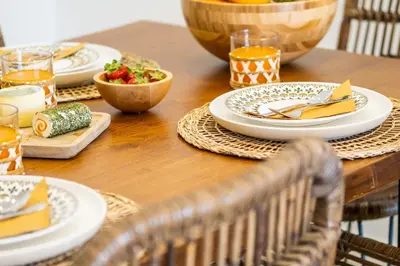 a wooden table with plates of food on it at Apartment Riu - Close to bars shops and restaurants in Albufeira