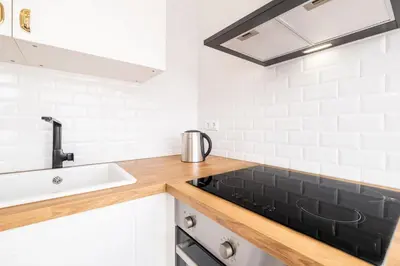 a kitchen with a sink and a counter top at Apartment Santana - In the heart of Albufeira in Albufeira