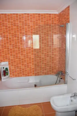 a kitchen counter with a sink with dishes on it at Casa Linda da Praia do Alfamar in Albufeira