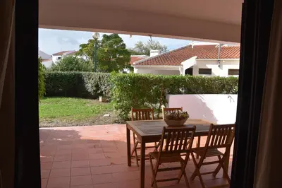 a laundry room with a washing machine and a window at Casa Linda da Praia do Alfamar in Albufeira