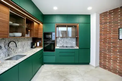 a kitchen with green cabinets and a brick wall at Green Algarve Gem Spacious 2 BDR By Misha's Place in Faro