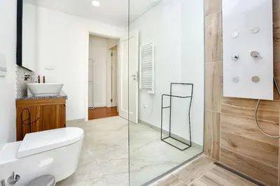 a bathroom with a white toilet and a sink at GREEN BLISS IN FARO, Central One-Bed Oasis in Faro