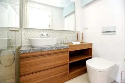 a bathroom with a sink and a toilet at GREEN FARO, MODERN DUPLEX with A BLISS TERRACE in Faro
