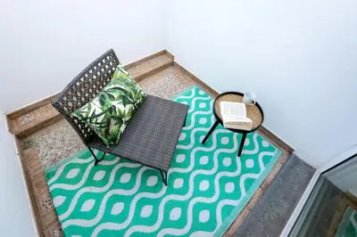 a white wall with a pattern on it at Green & Gorgeous - 3 bedroom Getaway in the Heart in Faro