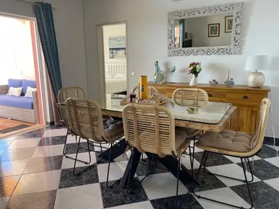 a dining room with a table and chairs at Cabana do Monte in Santa Bárbara de Nexe