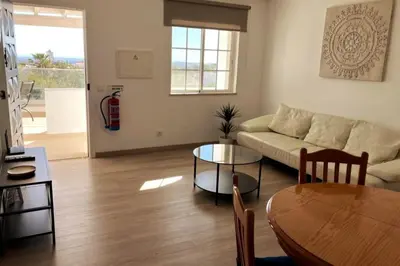 a living room with a couch and a table at Vila Lana - Heated pool - Sea view - Two independent floors in Faro
