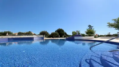 a large swimming pool with a hose at Green Valley 03- CleverDetails, Monte Verde, lux, distant sea view, 3 bedroom, 4 saltwater pools in Vilamoura