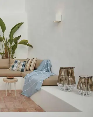 a living room with a couch and two lamps at Casa Pateo in Albufeira
