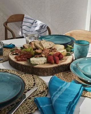 a table with a plate of food on a table at Casa Pateo in Albufeira