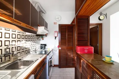 a kitchen with a sink and a counter top at Good Wave House in Vilamoura