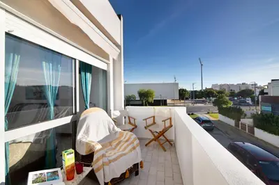 a balcony with a view of a parking lot at Good Wave House in Vilamoura