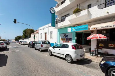 a white car parked on the side of a street at TAC - Sea Apartments 2D in Albufeira