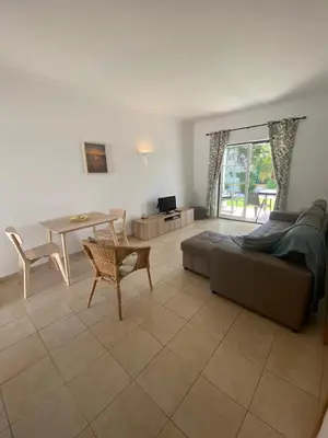 a living room with a couch and a table at Casa Rachael in Albufeira
