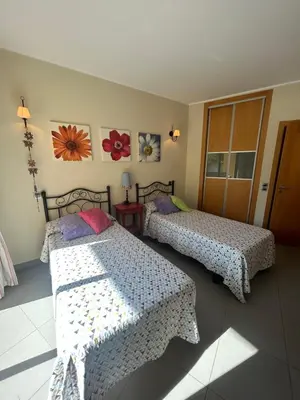 a living room with a couch and a table at Casa Paula in Quarteira