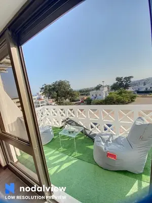 a view of a balcony with chairs and a table at HIMALAYA ROOFTOP Sea VIEW in Albufeira