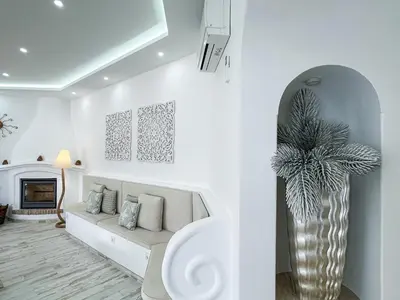 a living room with a couch and a fireplace at Luxury Villa Heated Pool, walk to São Rafael Beach, Albufeira in Albufeira