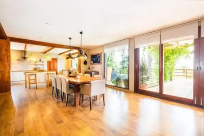 a kitchen and dining room with a table and chairs at Villa Palm Retreat - Beautiful idyllic views in Boliqueime