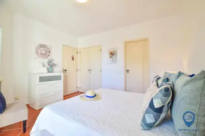a bedroom with a bed and a television in it at Balaia Golf by MTPhomes in Albufeira
