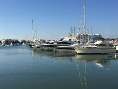 a group of boats docked in a harbor at Centralgarve - Cosy&Central 1bdrm in Vilamoura - Pateos da Marina in Vilamoura