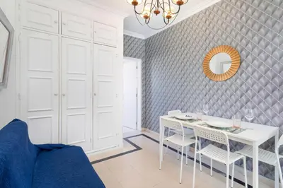 a dining room with a white table and chairs at Centralgarve - Cosy&Central 1bdrm in Vilamoura - Pateos da Marina in Vilamoura