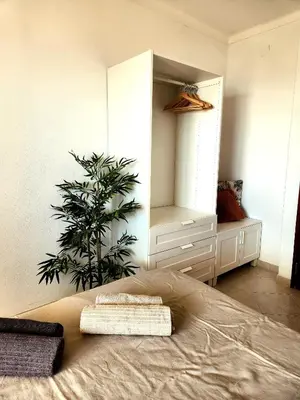 a bedroom with a bed and a potted plant at OceanView Side in Quarteira