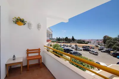 a balcony with a view of a parking lot at Apartment Montechoro in Albufeira