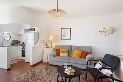 a living room with a couch and a table at Apartment Montechoro in Albufeira