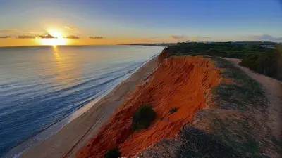 an aerial view of a beach at sunset at Falésia Nature Villa by The Portuguese Butler in Albufeira