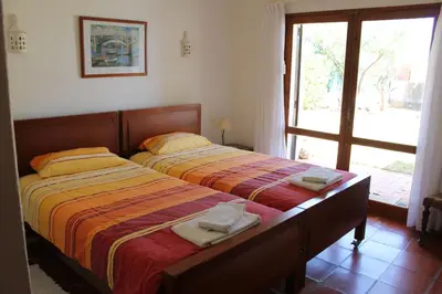 a bedroom with a bed with two towels on it at ABF18V3 Moradia qualidade e piscina,lindas v in Albufeira