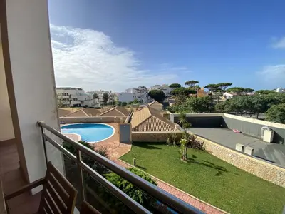 a balcony with a view of a swimming pool at Albufeira Sunny Style With Pool by Homing in Albufeira