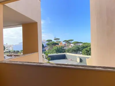 a balcony with a view of the ocean from a building at Albufeira Sunny Style With Pool by Homing in Albufeira