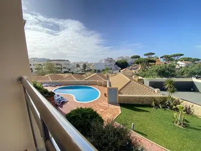 a view of a swimming pool from a balcony at Albufeira Sunny Style With Pool by Homing in Albufeira