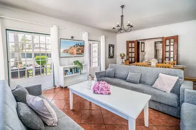 a living room with a table and a couch at Villa Rato in Galé