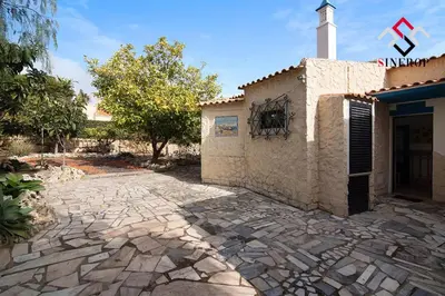 a stone patio in front of a building at Villa Tigonema in Albufeira