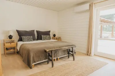 a living room with a coffee table and a staircase at Casalot Almancil in Almancil