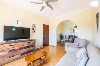 a living room with a couch and a flat screen tv at Villa Camila - Ideal location ten-min walk to Albufeira Marina in Albufeira