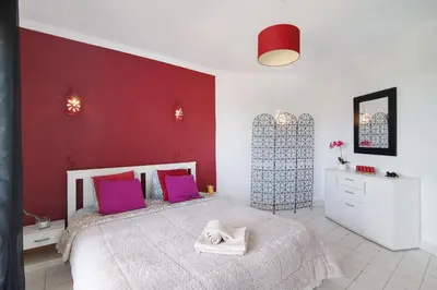 a hallway leading to a room with a bed at T1 Marques in Albufeira