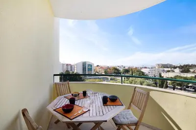 a balcony with a view of a city at T2 Tubio in Albufeira