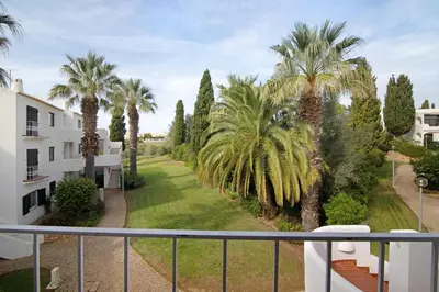 a view from the balcony of a apartment with palm trees at Flat 2 Bedrooms Cunha in Albufeira