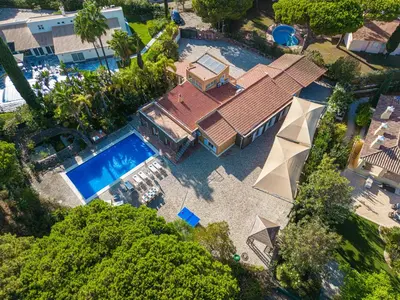 an overhead view of a house with a swimming pool at Villa Sea, Sun and Golf in Vilamoura in Quarteira