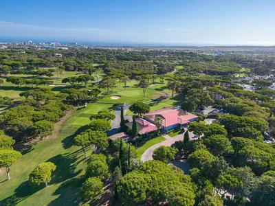 an aerial view of a park with a house and trees at Villa Sea, Sun and Golf in Vilamoura in Quarteira
