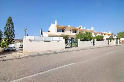 a house on the side of a road at Vila Alonzo in Albufeira