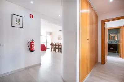 a living room with a fire extinguisher on a wall at Vilamoura - Spacious with Swimming Pool & View in Vilamoura